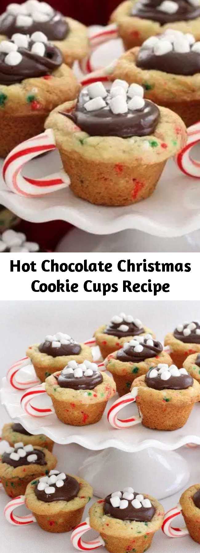 Hot Chocolate Christmas Cookie Cups Recipe - Hot Chocolate Cookie Cups are the most fun & festive Christmas cookies ever! Sugar cookie cups filled with fudge, mini marshmallows & sprinkles with a darling candy cane handle!