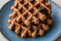 A plate of chocolate brownie waffles made with simple keto ingredients, perfect for Breakfast Ideas Gluten Free Healthy Recipes. Great for a Gluten Free On The Go Breakfast, low-carb eaters, or anyone looking for Sweet Chaffle Recipes Easy and Waffle Maker Recipes Healthy options.