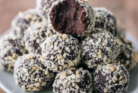 Delicious Chickpea Chocolate Truffles coated in crushed peanuts, showcasing a quick and easy Easy Healthy Chocolate Truffles recipe. Perfect Vegan Sweets for Chickpea Dessert Recipes Healthy or Patisserie Vegan treats, offering rich Healthy Chocolate flavor and a guide on How To Make Healthy Truffles.