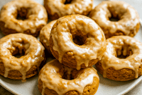 Golden Baked Donuts made with pumpkin, topped with shiny maple Donut Glaze—a cozy Homemade Donuts Recipe perfect for Fall Baking Recipes, Pumpkin Dessert lovers, and anyone looking for festive Herbst Rezepte or sweet Pumpkin Recipes Dessert ideas.