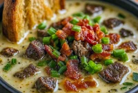 A steaming bowl of creamy Philly Steak Soup filled with tender steak, bell peppers, and melted cheese, perfect Cozy Fall Dinner Recipes and Fall Comfort Food Recipes, ideal Cheesesteak Soup Recipe and Soup Idea among Different Soups Recipes, showcasing a delicious Philly Cheese Steak Soup and other Unique Soups like Restaurant Soup Recipes.