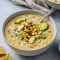 Close-up of a steaming bowl of Mexican Street Corn; a creamy White Chicken Chili topped with cotija, avocado and bacon — evokes Corn Chili and White Chili vibes; a Corn Chicken twist; a simple White Chili Chicken Recipe and easy Chicken Chili Recipe; classic Street Corn flavors meet Chicken Chili comfort.
