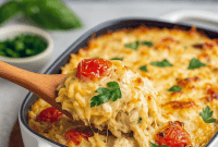 Cheesy and creamy Orzo Tuscan Chicken bake fresh from the oven, perfect Orzo Pasta Casserole with tender chicken, ideal Orzo Baked Chicken and Chicken Orzo Pasta Bake for a comforting family meal, easy Easy Dinner Recipes Oven Bake, delicious Orzo Chicken Bake Recipes and Orzo Pasta Recipes Chicken, Tuscan style Tuscan Chicken With Orzo and Tuscan Chicken And Orzo Recipes.