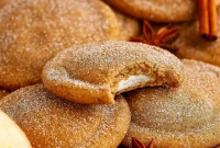 A batch of chewy Apple Cider Cheesecake Cookies filled with creamy cheesecake, brushed with butter, and dusted in spiced sugar — the ultimate Fall Festive Food and one of the Best Fall Cookie Recipes for cozy baking.