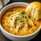 Bowl of creamy Parmesan chicken soup from Crock Soup Recipes, an Easy Chicken Soup Crockpot loaded with tender chicken, melted cheese, and herbs—perfect Crockpot Creamy Parmesan Soup, Creamy Parmesan Chicken Soup, Chicken Parm Soup Crockpot, Crockpot Creamy Chicken Parm Soup, Chicken Parmesan Soup Crockpot, Soup Crock Pot, and Creamy Parmesan Chicken Soup Crockpot.