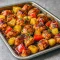 Overhead view of a colorful Hawaiian Chicken And Veggies dish with pineapple, peppers, and onions on a sheet pan — the perfect choice for Amazing Family Dinners and quick Hawain Chicken Sheet Pan meals. A vibrant Hawaiian Sheet Pan Dinner that works as a weeknight Hawaiian Chicken Bake, ideal for One Tray Meals and Natural Dinner Recipes. Great for easy Sheet Tray Dinners and simple Meals For 3.