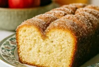 Soft Cinnamon Sugar Loaf with a crunchy Spiced Apple Cider Donut Loaf With Cinnamon Sugar Crust, perfect as a Cinnamon Sugar Pull Apart Loaf or Apple Cider Donut Loaf Cake Bon Appetit, a Cinnamon Pull-apart Bread In Loaf Pan for Quick Fall Desserts, alongside Pumpkin Spice Muffins, Spiced Apple Cider, and Apple Cider Donuts.
