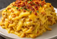 A bubbling Southern Chicken Spaghetti Bake topped with melted cheddar cheese and garnished with green onions, perfect for Easy Kid Approved Dinners, 90s Dinner Recipes, Simple Fast Dinner Ideas, Easy Meals To Feed A Crowd, Creamy Chicken Spaghetti, Cheap Chicken Dinners, Fall Casserole Recipes For Dinner, and Cheap Meals For A Crowd.