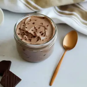 Glass jar of creamy Low Calorie Chocolate Yogurt topped like a Weight Watchers Yogurt Parfait, perfect for a Diy Yogurt Parfait Bar and other Healthy Desserts With Yogurt.