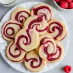Close-up of golden shortbread slices with a vivid raspberry ribbon — styled as Wedding Shortbread Cookies and Shortbread Swirl Cookies, a festive spin on a classic Spritz Cookie, rivaling store-bought Harry And David Raspberry Cookies.