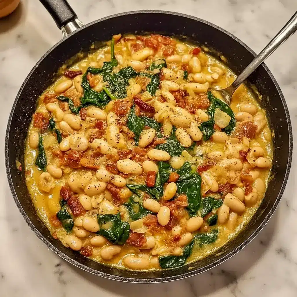 Skillet of creamy white beans, wilted spinach, and sun-dried tomatoes finished with grated Parmesan and fresh herbs, served with crusty bread, Easy Healthy Dinner Fall.