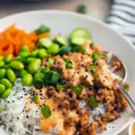 A colorful Bang Bang Ground Turkey Bowl topped with creamy sauce, sesame seeds, and green onions — an easy Low Effort Dinner inspired by Define Dish Recipes, perfect for Non Red Meat Meals and weeknight Alpha Gal Meals.