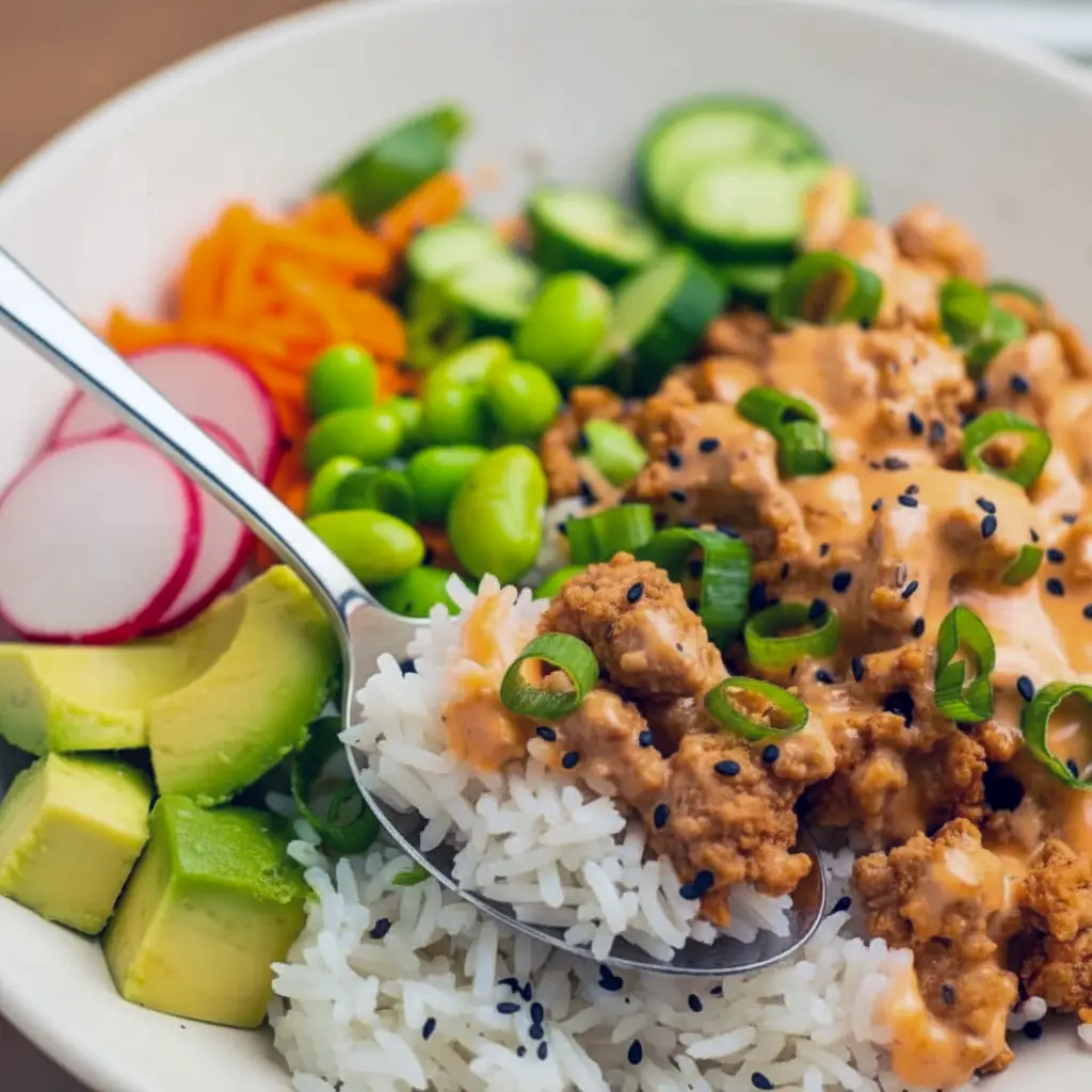 A colorful Bang Bang Ground Turkey Bowl topped with creamy sauce, sesame seeds, and green onions — an easy Low Effort Dinner inspired by Define Dish Recipes, perfect for Non Red Meat Meals and weeknight Alpha Gal Meals.