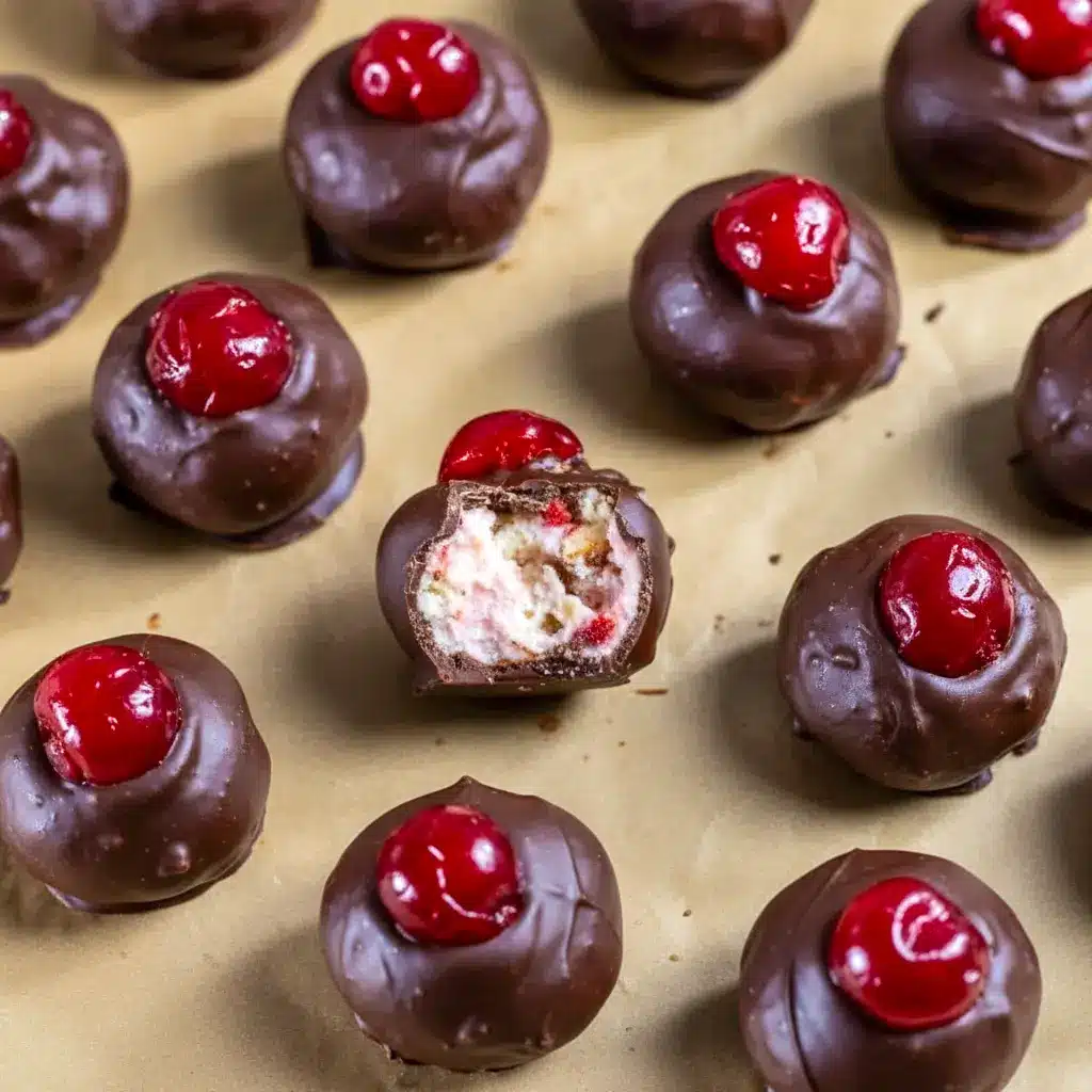 Close-up of glossy Chocolate Cherry Bourbon Balls topped with candied cherries — the perfect Cherry Balls Christmas treat for festive dessert tables and Holiday Snack Gifts.