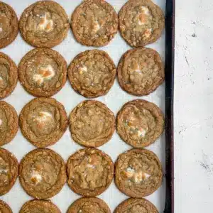 Close-up of golden-brown cookies studded with mini marshmallows and cereal — Crispy Marshmallow Cookies, a simple Marshmellow Cookie Recipe, Marshmallow Cookies Easy.