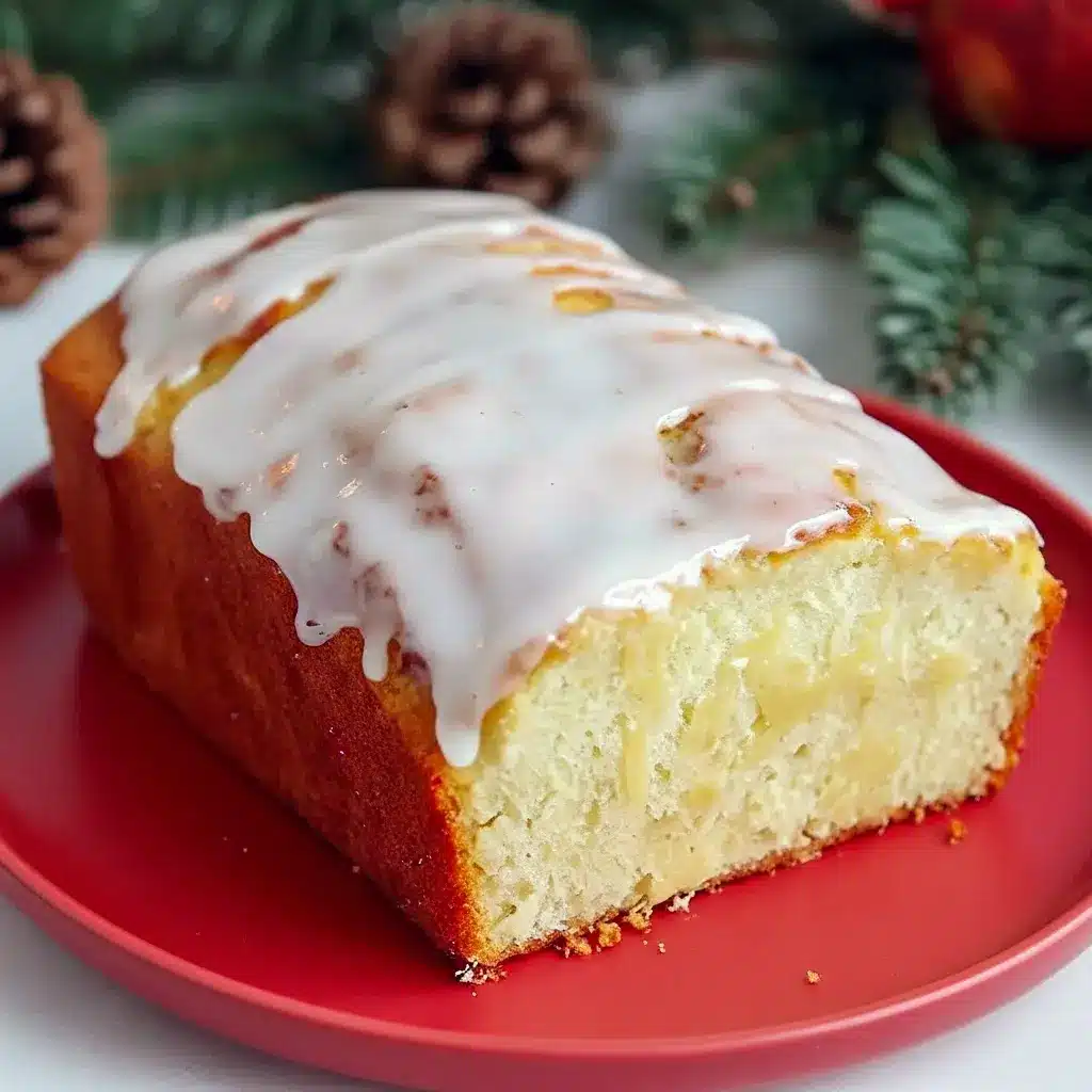 Close-up of a rum-glazed holiday loaf on a wire rack: a moist Eggnog Quick Bread that smells like Christmas Eggnog, ideal as an Eggnog Bread Recipe or adapted into an Eggnog Bread Recipe With Yeast for a chewier bite, Eggnog Bread With Rum Glaze.