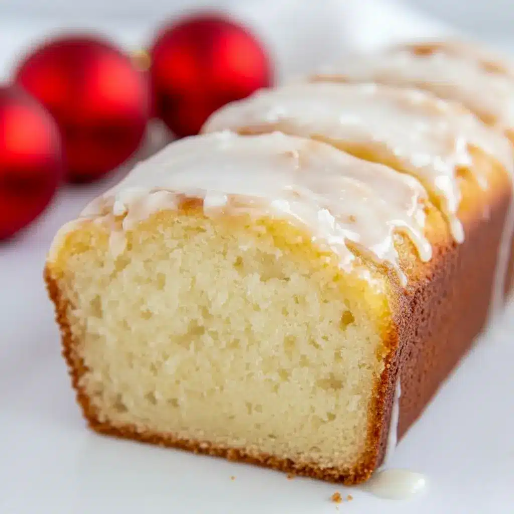 Close-up of a rum-glazed holiday loaf on a wire rack: a moist Eggnog Quick Bread that smells like Christmas Eggnog, ideal as an Eggnog Bread Recipe or adapted into an Eggnog Bread Recipe With Yeast for a chewier bite, Eggnog Bread With Rum Glaze.
