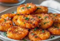 Close-up of golden, crispy smashed carrots topped with grated Parmesan and parsley — Healthy Yummy Side Dishes.