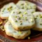 Pistachio Shortbread Cookies — golden, buttery rounds studded with chopped pistachios, dusted with powdered sugar; a beautiful tray-ready Shortbread Biscuits shot.