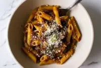 Close-up of Balsamic Mushroom Pasta coated in a glossy Balsamic Sauce For Pasta, finished with grated Parmesan and fresh thyme.