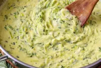 Zucchini Sauce coating rigatoni with fresh basil and grated cheese, an example of Healthy Sauces For Pasta.