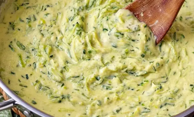 Zucchini Sauce coating rigatoni with fresh basil and grated cheese, an example of Healthy Sauces For Pasta.