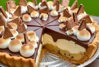 Slice of S’mores Cookie Dough Pie with golden toasted marshmallows, gooey chocolate pockets, and a crisp Dessert Pies crust — perfect inspo for Cookie Pie Recipes.