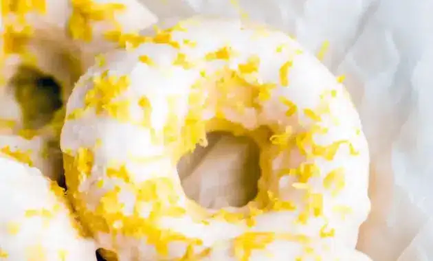 Stack of lemon-vanilla baked donuts with a glossy glaze — Easy Protein Donut Recipe styled as Glazed Protein Donuts and labeled Gluten Free Protein Donuts.