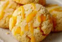 Close-up of chewy mango cookies on a cooling rack, dusted with sugar — Fruit Flavored Cookies ready to eat.