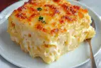 Golden slice of Spaghetti Squash Au Gratin with melted mozzarella and a crisp Parmesan crust, plated and ready to serve.