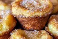 Close-up of fluffy Cinnamon-Sugar French Toast Muffins brushed with butter and sprinkled with cinnamon sugar — a handy Freezable Breakfast Recipes option for busy households.
