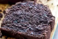 Dark Chocolate Mocha Breakfast Bread — sliced loaf with dark, tender crumb and melted chocolate chips, served on a wooden board.