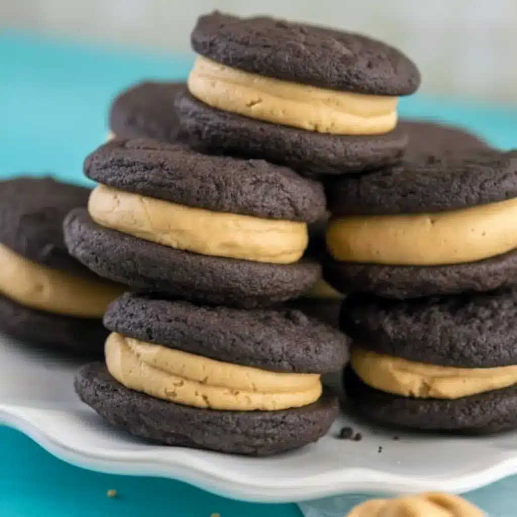 Stack of Homemade Peanut Butter Oreos showing soft chocolate sandwich cookies filled with creamy peanut butter frosting, styled like a rich homemade dessert.