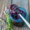 A jar of Blueberry & Lavender Jam with a spoon beside it, styled as a beautiful Homemade Lavender Jam Recipe for toast and gifting.
