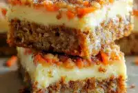 A tray of Peanut Butter Blondies styled as Carrot Cake Bars With Cream Cheese, with a soft swirl and Easter-inspired presentation.