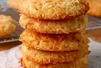 Chewy Coconut Cookies on a parchment-lined tray with Recipes With Sweetened Coconut styling, golden edges, and a soft coconut texture.