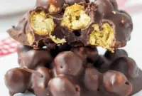 Chocolate Chickpeas in bite-sized clusters coated with dark chocolate, showing a crunchy Sweet Chickpeas Snack and an easy Chocolate Chickpea Clusters dessert.