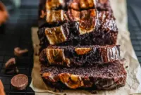 A slice of Chocolate Espresso Banana Bread with melted chocolate chips and a soft, rich crumb, shown as a decadent Bread Recipes Sweet treat on a plate.