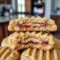 Tray of Peanut Butter and Jelly Stuffed Cookies with a soft, chewy center and a gooey jam filling, styled as a Soft Peanut Butter Cookie Recipe.