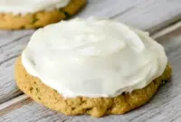 A plate of Zucchini Cookies topped with creamy frosting, styled as a soft homemade dessert inspired by Zucchini Cookies With Cream Cheese Frosting and Zucchini Recipes Cookies.