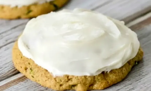 A plate of Zucchini Cookies topped with creamy frosting, styled as a soft homemade dessert inspired by Zucchini Cookies With Cream Cheese Frosting and Zucchini Recipes Cookies.