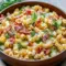 Dill Pickle Bacon Pasta Salad in a creamy bowl with crunchy bacon and Fun Salad Recipe appeal for parties.