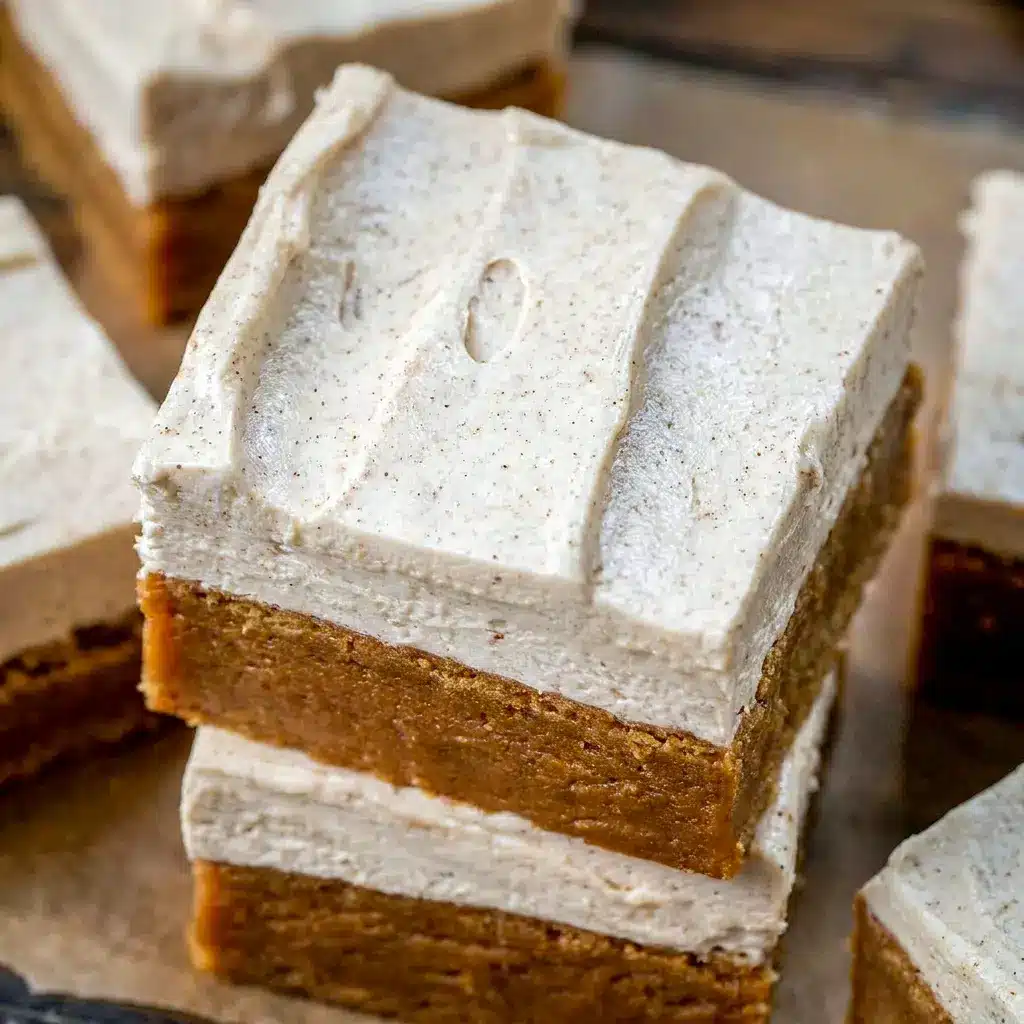 A platter of Frosted Gingerbread Brownies cut into neat servings, ideal for Holiday Desserts For A Crowd at Christmas parties.