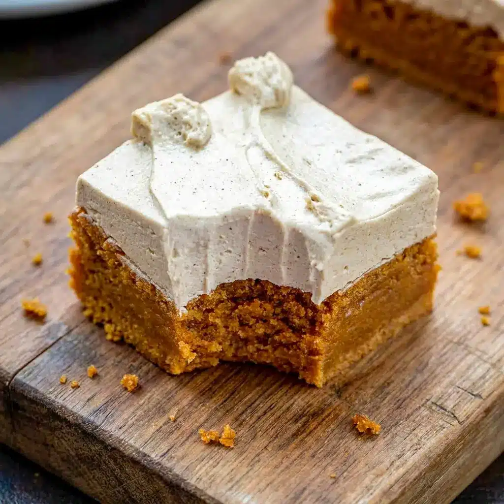 A decadent slice of Frosted Gingerbread Brownies with fluffy icing, making a festive Specialty Brownies dessert for winter gatherings.