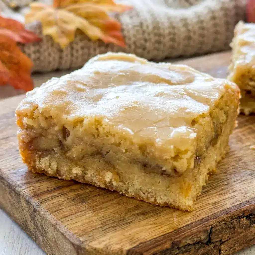 Stack of Maple Glazed Apple Blondies squares with glossy icing and tender apple layers, a sweet idea for Fall Desserts Blondies.