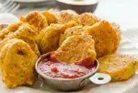 Chickpea Vegetable Nuggets on a toddler lunch plate with dipping sauce, a fun idea for Chickpea Recipes For Toddlers.