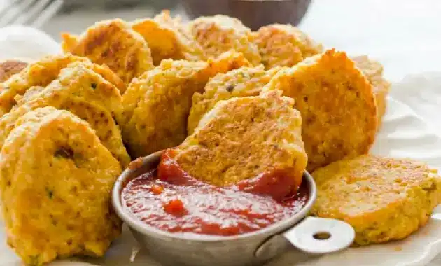 Chickpea Vegetable Nuggets on a toddler lunch plate with dipping sauce, a fun idea for Chickpea Recipes For Toddlers.