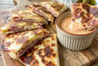Corned Beef and Swiss Reuben Quesadillas served with creamy dipping sauce, perfect Sandwiches Sides for a cozy deli-style meal.