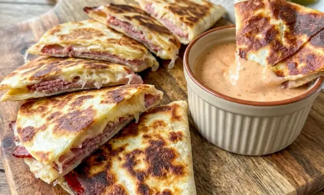 Corned Beef and Swiss Reuben Quesadillas served with creamy dipping sauce, perfect Sandwiches Sides for a cozy deli-style meal.