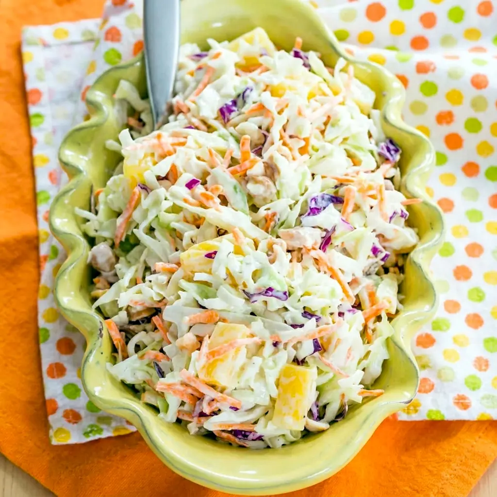 Creamy Hawaiian Pineapple Coleslaw with crisp cabbage, topped with Hawaiian Coleslaw Dressing for extra flavor.